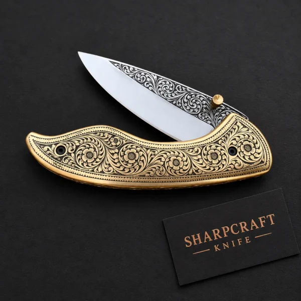 Brass Tone Engraved Folding Knife — alternate product view on black with Sharpcraft Knife card
