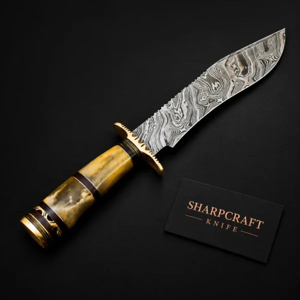 Damascus Bowie Knife Natural Horn on a black background with Sharpcraft Knife card