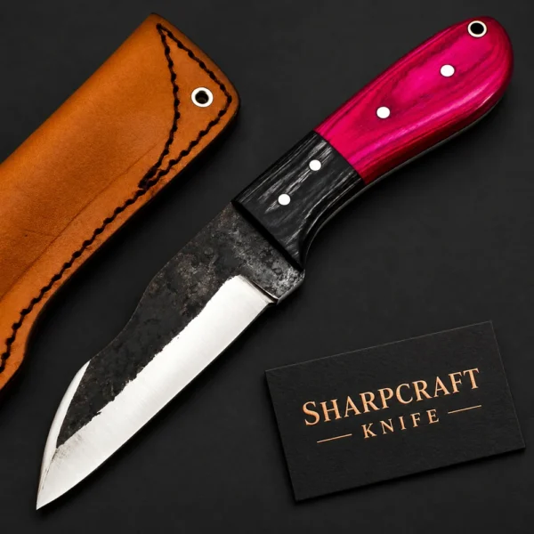 Pink Handle Fixed Blade Knife photographed on black with a Sharpcraft Knife visiting card