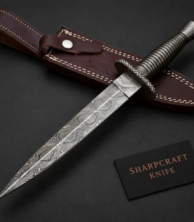 Slim Damascus Dagger with Dark Ribbed Handle — main product view on black with Sharpcraft Knife card